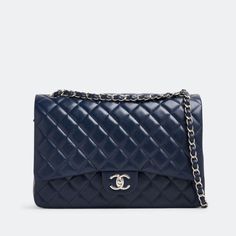 Chanel's Maxi Classic Double Flap bag is exquisitely crafted from quilted leather and bears the signature label inside the leather interior and the iconic CC turn-lock on the flap. This navy blue piece is detailed with silver-tone hardware and finished with a leather and chain adjustable strap. This item comes with the original box and dust bag. This pre-owned piece will make a great contribution towards sustainability and an even greater contribution towards your wardrobe. Dimensions: 33.5cm x Chanel Navy Blue Bag, Navy Chanel Bag, Chanel Blue Bag, Blue Chanel Bag, Wardrobe Dimensions, Blue Chanel, Chanel Maxi, Navy Blue Bag, Navy Chanel