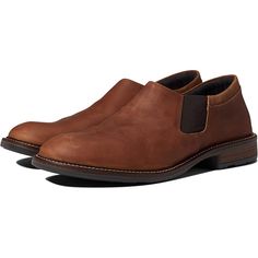 The men's Naot Director slip on dress shoe is the epitome of classy comfort. The premium leather upper, stacked heel, and detailed stitching make this style a stand-out. Luckily, the Director feels as good as it looks - you'll love the padded lining, instep gore, and flexible strobel construction that ensure all day comfort. Features: Premium leather upper Elastic gore at the instep Padded heel cup and lining Metal shank Hand sewn strobel construction TPR outsole Style Number: 80023-SEG Semi-formal Slip-on Dress Shoes With Goodyear Welt, Semi-formal Slip-ons With Stitched Sole, Semi-formal Slip-on Dress Shoes With Leather Footbed, Moc Toe Slip-ons For Business In Fall, Business Slip-ons With Moc Toe For Fall, Fall Business Casual Moc Toe Slip-ons, Slip-on Dress Shoes With Leather Footbed, Slip-on Plain Toe Dress Shoes For Fall, Masculine Business Casual Slip-ons