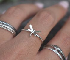 Dragonfly Ring details:-Solid .925 sterling silver-Dragonfly measures 10mm x 8mm,- Ring band measures 1.2mm wide-Comfortable and easily stackable!-Available in US sizes 1-11 with half sizes. Connect with us on Instagram @a_wild_violet for sales and giveaways!**All items are in stock and ship within 2-5 business days from received payment (excluding Saturday/Sunday) from the US. If you are within the US please expect 3-7 business days for shipping transit and delivery. International orders please Bug Ring, Insect Ring, 15 Rings, Dragonfly Ring, Dragonfly Jewelry, Favorite Rings, Ring Band, Sterling Ring, Silver Band