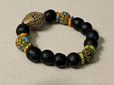 This listing is for 30 pieces of african Ghana beads and brass bracelets, in assorted patterns. You, can send a message is you need any more information on this listing African Beads Bracelets Handmade, Male Bracelets, Ghana Beads, Bracelet Board, African Beaded Bracelets, African Bracelet, African Inspired Jewelry, Glass Bracelets, African Beads Necklace