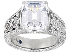 Vanna K™ For Bella Luce® white diamond simulant 9.17ctw rectangle and round, Platineve® ring. Measures approximately 0.88" L x 0.44" W and is not sizable. The diamond equivalent weight is 5.55ctw. Each Vanna K™ design has a signature label that features a lab created sapphire. Luxury White Radiant Cut Ring, White Radiant Cut Cubic Zirconia Ring, White Radiant Cut Rings Fine Jewelry, White Radiant Cut Fine Jewelry Ring, White Platinum Ring With Accent Stones, White Diamond Cut Square Cut Ring, White Square Cut Ring For Anniversary, White Diamond Square Cut Ring, White Diamond Ring With Square Cut