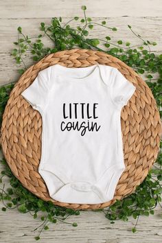 Little Cousin Baby Bodysuit or T-Shirt  *Bodysuits are Carter's brand. Please see their sizing chart if you aren't sure what size to order. *All bodysuits are white. The color you choose is for the text/image.  *If you would like a colored bodysuit, please request a custom order and we can see if we can meet your needs. Please note though that there is usually an added charge for this. *Each design is professionally cut and heat pressed to the bodysuit. SHIPPING All orders take 1-4 days to proce Casual Unisex Onesie With Letter Print, Fitted White Short Sleeve Bodysuit With Letter Print, White Short Sleeve Bodysuit With Graphic Print, White Fitted Short Sleeve Bodysuit With Graphic Print, Casual Fitted Onesie For Birthday, Fitted Short Sleeve Bodysuit With Letter Print, Casual Fitted Birthday Onesie, Casual Cotton Onesie With Letter Print, Casual Fitted Short Sleeve Bodysuit With Letter Print