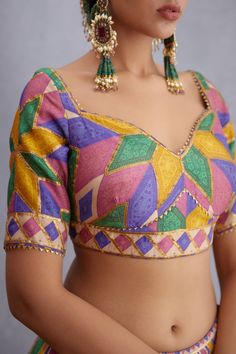 Editor's Note Featuring Navratan Shamiyana Lehenga Set Color: Multicolor Fabric: Handwoven Chanderi, Pure Cotton Silk, Dupion Components: Lehenga, blouse and dupatta Occasion: Haldi mehndi and sangeet Care: Dry Clean Only About the Designer Torani by Karan Torani stands handcrafted luxury inspired by the myriad tales of Indian mythology. Torani is a potpourri of all things nostalgic that binds you with a memory long forgotten. The label works with and revives timeless Indian textiles and embroid Indian Mythology, Blouse Yoke, Personal Shopping Service, Saree Designs Party Wear, Trendy Blouse, Lehenga Blouse, Trendy Blouses, Indian Textiles, Trendy Blouse Designs