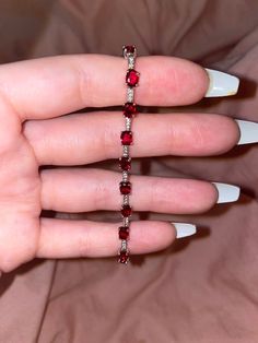 Simple yet elegant ruby bracelet with Swarovski crystals in between the rubies made with real silver. Ruby Jewelry Silver, Rubies Jewelry, Red Jewellery, Red Bracelet, Diy Jewelry Necklace, Fancy Jewellery Designs, Ruby Bracelet, Swarovski Crystal Bracelet, Swarovski Bracelet