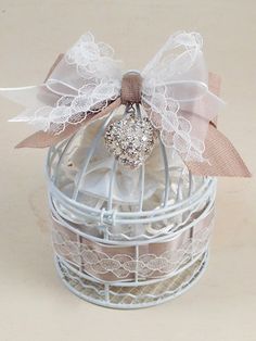 a birdcage with a bow on it