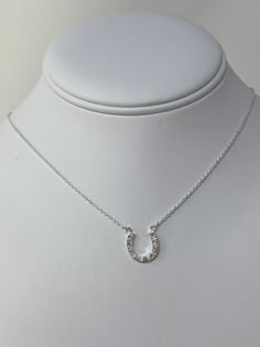 Minimalist Sterling Silver Simulated Diamonds Set Horse Shoe Necklace. Lucky Horse Shoe Charm Necklace With CZ Diamonds. Minimalist Chain With Extension Sterling Silver Horse Shoe Necklace ------------------------------------- Pendant Length: L- 1/2 INCH Pendant Width: W- 1/2 INCH Weight:3.2 gram Nickel and Lead Free:YES ------------------------------------- You will receive the item in a gift pouch. This is a beautiful necklace, sure to make you feel special. Treat yourself or give as a gift! P White Sterling Silver Rhinestone Necklace For Gift, Horseshoe-shaped Jewelry With Adjustable Chain For Gifts, Horseshoe Jewelry With Adjustable Chain For Gifts, Elegant Horseshoe Necklace For Everyday, Horseshoe Necklace With Adjustable Chain For Gift, Horseshoe Necklace With Adjustable Chain As Gift, Silver Horseshoe Jewelry Gift, Silver Horseshoe Necklace For Gift, Silver Sterling Silver Horseshoe Necklace