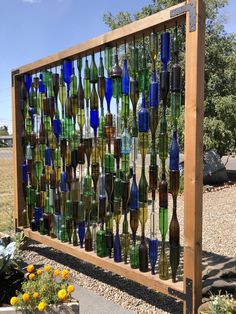 a wooden fence made out of wine bottles