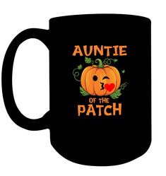 a black coffee mug with an orange pumpkin and the words,'aunte of the patch