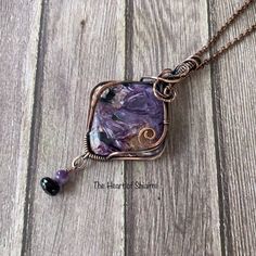 This stunning, chatoyant stone of Charoite has a beautiful mix of purple, white, black, and brown. It is wrapped in oxidized copper wire. A dangle of Amethyst and faceted Black Spinel hangs from the bottom. It comes on a copper chain or black leather cord in a choice of lengths. CHAROITE is a stone of transformation. It is the soul stone that overcomes fear. Charoite stimulates inner vision and spiritual insight and aids in coping with enormous change at a spiritual level. To facilitate this, it synthesizes the heart and crown chakra's, cleanses the aura, and stimulates unconditional love. BLACK SPINEL is a protective stone that repels negativity and grounds the user while evoking inspiration and empowerment, without overwhelming others. It is also thought to help one find calmness and let Soul Stone, Oxidized Copper, Les Chakras, Wire Pendant, Black Spinel, Copper Chain, Wrapped Pendant, Unconditional Love, Wire Wrapped Pendant