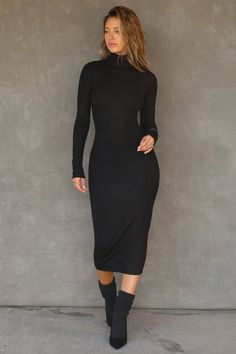 Fitted long sleeve midi dress with a mock neckline. Feel a subtle pop of texture in this tight-knit ribbed fabric. It's stretchy, comfortable and forms perfectly to your body. Color: Black Rib Size: X/S (0-2), S/M (4-6), M/L (8-10) Model is 5'8" and wearing size X/S Fabric: 95% Ribbed Rayon, 5% Spandex Care: Machine Wash Cold With Like Colors.Care: Lay Flat to Dry. JOAH BROWN | MADE IN LOS ANGELES Midi Mock Neck Dress Outfit, Chic Ribbed Long Sleeve Midi Dress, Black Long Sleeve Ribbed Midi Dress, Mock Neck Midi Dress, Black Ribbed High-neck Bodycon Dress, Black Ribbed Long Sleeve Maxi Dress, Elegant Black Ribbed Sweater Dress, Black Long Sleeve Midi Dress, Fitted Long Sleeve