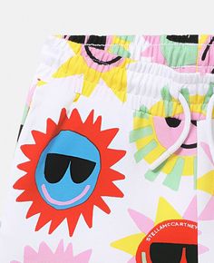 Playful Beach Shorts, Playful Yellow Summer Shorts, Playful White Summer Bottoms, Playful White Shorts For Vacation, Playful Multicolor Bottoms For Summer, Playful Summer Shorts, Playful White Shorts For Beach Season, Playful Multicolor Summer Bottoms, Fun Cotton Shorts For Spring