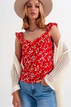 This beautiful top boasts of a sweetheart neckline, stretchy frill sleeves, a relaxed cropped fit, and a shirred elastic back.  The red and white ditsy floral print makes a bold fashion statement for the spring and summer months.  Made from soft, woven fabric of 100% Viscose.   The model is 5’9” with measurements of 32-24-35 and is wearing a size small. The fit runs true to size. Minimalist Winter Wardrobe, Minimalist Dresses, Ditsy Floral Print, Frill Sleeves, Online Fashion Boutique, Woven Top, Ditsy Floral, Cami Top, Belted Dress