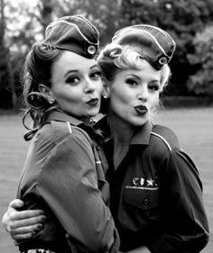 two women in uniform hugging each other