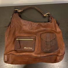 In Decent Condition, Has Been Worn A Lot. Leather On Strap Needs To Be Fixed But Otherwise Wearable. Brown Leather Satchel Bag, Brown Leather Satchel, Miu Miu Bag, Leather Satchel Bag, Pretty Bags, Satchel Bag, Leather Satchel, Satchel Bags, Miu Miu