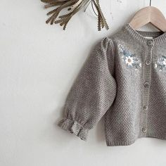 Stay stylish and comfy with our "Daisy Garden” cardigan. Adorned with beautiful, embroidered flowers on the chest and featuring long puffed sleeves with gathering at the wrist that forms delicate frills. Perfect for any occasion, your little girl will look adorable and feel comfortable in this charming piece. Material: Cotton Age Range: 9 Months-3 Years Fit: Fits true to size, take your normal size Daisy Cardigan, Flower Lantern, Apricot Sweater, Flower Sweater, Girls Cardigan, Floral Sleeve, Kids Coats, Boys Coat, Long Puff Sleeves