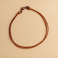 Approx. 14" Handmade in Laurel, Mississippi Beautifully colored natural brown leather with Novi's signature clasp allowing it to snap together with other NoVi bracelets for an original look. Wraps around the wrist twice, or can be worn as a choker. For a looser fit, add an extender! Adjustable Leather Necklaces For Everyday, Adjustable Leather Necklace For Everyday, Everyday Brown Jewelry With Waxed Finish, Everyday Brown Leather Strap Jewelry, Brown Jewelry With Waxed Finish As Gift, Everyday Leather Jewelry With Adjustable Cord, Everyday Brown Leather Necklace, Leather Jewelry With Adjustable Cord For Everyday Use, Brown Waxed Finish Jewelry As Gift