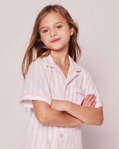 The sleepwear is made from the finest quality cotton and blended with just enough inherently flame retardant fiber to allow it to pass strict CPSC flame retardant laws without using harmful chemicals. The fabric is brushed for added softness, making the sleepwear feel absolutely luxurious, getting cozier after each wash.In our luxurious sleepwear, your little one will be tucked in love and off to dreamland. Bonne nuit. Luxurious Sleepwear, Pajama Short Set, Pajama Short, Luxury Sleepwear, Pink And White Stripes, Flame Retardant, Shoe Size Conversion, Short Pajama Set, Short Set