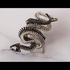 Please Make A Reasonable Offer!! ****** Nwot!! Never Worn, To Small On Me ****** Ladies Rings, 2 Snakes; Double Intertwined; 1 Silver & The Other Black ****** Material: Copper ****** Size 6 ****** Both Snake Rings Included In This Listing ****** You Can Wear Singly Or Together--Versatile!! Totally Unique & Beautiful Designed W/W/All Its Particular Details & More A Creative & Handmaid Jewelry Grunge Ring, Snake Rings, Skeleton Ring, Goth Ring, Barrel Ring, Ladies Rings, Serpent Ring, Barrel Rings, Red Stone Ring