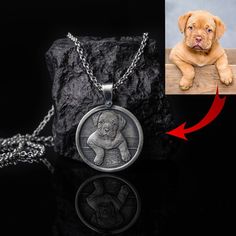 a dog is shown in the center of this necklace