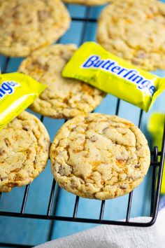 butterfingered cookies cooling on a rack with the words butterfingerer cookies above them