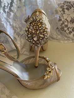 "COLORS: *CHAMPAGNE/GOLD, *Ivory/gold, *Off-white/gold, *White/Silver, *Silver/Silver, Off-white Silver.* the center adornment will be the same as the one on the video only. HEEL: 3 1/2\" inches heel US SIZES: B5, 5.5, 6, 6.5, 7, 7.5, 8, 8.5, 9, 9.5, 10, and 11. FINAL SALE! NO RETURNS, NO EXCHANGES, PLEASE CONTACT FOR ANY QUESTIONS, OR HELP YOURSELF WITH SIZING GUIDE PICTURED ABOVE. SHOES CAN NOT BE RETURNED OR EXCHANGED; I'll make all the efforts to help you have a pleasant shopping experience; Gold Shoes Bridesmaid, Gold Wedding Shoes With 4-inch Heel, Gold Open Toe Wedding Shoes With Rhinestones, Elegant Gold High Heels, Elegant Gold Heels With Rhinestones, Elegant Gold Wedding Shoes For Evening, Elegant Gold Embellished Heels, Elegant Embellished Gold Heels, Gold Heels With Rhinestones For Wedding