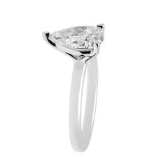 a pear shaped diamond ring on a white background