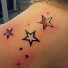 the back of a woman's shoulder with stars on it