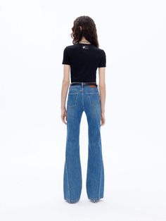 MO&Co. Women's Mid Waist Flared Jeans Features : - Five-pockets design- Mid waist, flared fitted- Slanted seam details- Leather logo patch at back waistband Code: MBD1JENK01The back length of size M(27) is 108cmMATERIALS & CARE Material: 96.7% Cotton 2.7% Polyester 0.6% SpandexSeparate mild machine wash below 30°CDo not bleach, hang to dryDo not tumble dry, low ironDo not dry clean, do not expose to the sunWash the reverse side into the mesh bag, do not soakNotice:1. The parts of the leather tag Fitted Bottoms With Contrast Stitching For Spring, Spring Fitted Bottoms With Contrast Stitching, Fitted Mid-rise Bottoms With Contrast Stitching, High Rise Fitted Pants With Contrast Stitching, Fitted High Rise Pants With Contrast Stitching, Casual Fitted Bottoms With Seam Detailing, Casual Fitted Flare Jeans With Contrast Stitching, Fitted Wide-leg Pants With Contrast Stitching, Fitted Wide Leg Bottoms With Contrast Stitching