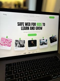 an open laptop computer sitting on top of a desk with the words safe web for kids to learn and grow