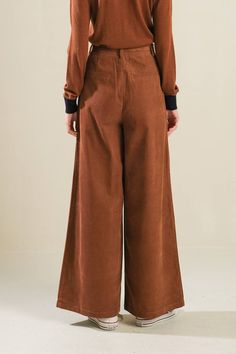 A solid woven pant featuring front closure, self sash tie, front pleat and wide leg Belted Full-length Pants For Fall, Belted Full-length Bottoms For Fall, Fall Wide Leg Pants With Tie Waist, Workwear Wide Leg Pants With Tie Waist, Wide Leg Pants With Tie Waist For Work, Brown Belted Pants For Fall, Belted Brown Pants For Fall, Solid Color Wide Leg Pants With Tie Waist, Fall Tie Waist Wide-leg Pants