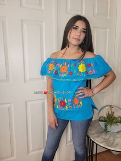 "Have a Touch of Color with this one of a kind made with LOVE Mexican Hand Embroidered Style Top. It fits comfortably and can be used casually with your favorite jeans or dress it up with a jacket and pumps. Must know: Each piece is made with Love (Handcrafted) and there could be a difference in pattern and colors from the profile picture. Fabric is comfortable cotton known as manta. Washing instructions: Handwash (preferable) Use delicate cycle Air dry Sizes: Onesize (Unitalla) Bust 38-40\" Len Bohemian Embroidered Peasant Top For Festival, Embroidered Hippie Peasant Top, Bohemian Cotton Tops With Machine Embroidery, Bohemian Floral Embroidered Peasant Top For Festivals, Bohemian Cotton Blouse With Machine Embroidery, Handmade Blue Tops For Festival, Handmade Bohemian Blue Tops, Handmade Blue Bohemian Tops, Hippie Floral Embroidery Peasant Top For Festival