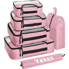 five pieces of pink luggage with black zippers and the word veken written on it