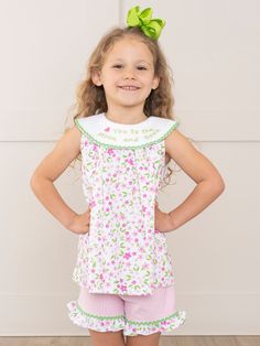 Bask in the sunny warmth of familial bonds with our latest exclusive MNC Basics collection: Family Love. Our soft, comfortable, high quality fabric is back in soft stripes, dainty florals, and ruffles galore. With embroidered messaging expressing love to the family, your little ones will love these spring basics! The perfect outfit for your little one's next adventure! This girls' shorts set features a pink floral swing top with a loving green embroidered message of "🩷 You to the Moon and Back" Spring Sleepwear With Ruffles, Fitted Cotton Sleepwear For Spring, Fitted Cotton Sleepwear With Ruffles, Spring Fitted Ruffled Sleepwear, Fitted Ruffled Sleepwear For Spring, Spring Fitted Sleepwear With Ruffles, Playful Sleeveless Top For Sleepovers, Fitted Cotton Top For Bedtime, Cute Floral Print Sleepwear For Spring