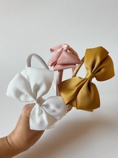 These headband bows are timeless and comfortable for babies and toddlers. They come in three colors. Summer Bow Headband, Summer Decorative Bow Headband, White Bow Tie Hair Accessories For Summer, Adjustable Detachable White Bow, Spring Satin Bow Headband, Adjustable White Satin Bow, Spring Bow Headband, White Headband With Bow Tie, White Bow Tie Headband