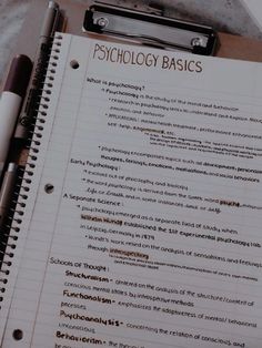 a notepad with the words psychology basics written on it