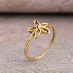 Gold flower ring, dainty ring, birthday gifts, floral ring, gift for her, minimalist ring, stackable ring, engagement ring, promise ring.  ♥ DETAILS ♥ *Materials: Brass *Size: All sizes are available. ♥ DELIVERY ♥ *IMPORTANT: Before placing an order, please double check your delivery address is correct and complete to avoid delays and lost packages. *You can return your purchased item within 15 days after successful delivery. *We offer a 100% "Money Back Guarantee" if you are not satisfied with Dainty Stackable Rings As Gift, Dainty Stackable Rings Gift, Dainty Midi Rings For Gifts, Dainty Stackable Rings With Simple Design As Gift, Dainty Handmade Midi Rings For Promise, Handmade Dainty Yellow Gold Stackable Rings, Dainty Handmade Yellow Gold Stackable Rings, Dainty Handmade Stackable Promise Rings, Handmade Delicate Stackable Rings