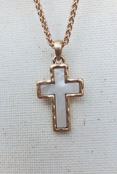 This enchanting mother of pearl cross necklace comes on a worn gold chain that is 20" with a 2" extender. It's attached with a matching worn gold bail.  A perfect present for yourself, mother, best friend, bridal party or Christmas Present. Pearl Cross Necklace, Religious Cross, Mother Of Pearl Necklace, Mother Of Pearl, Gold Chains, Bridal Party, Cross Necklace, Pearl Necklace, Pendant Necklace