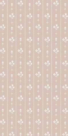 a beige and white striped wallpaper with small flowers on the bottom half of it