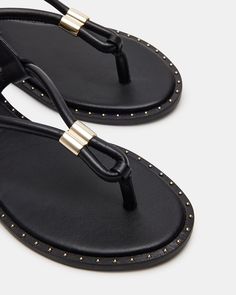 The MEDUZA is a studded thong sandal designed for style and comfort. With its sleek edgy mini studs, this shoe is perfect for everyday wear or a night out. Its unique design provides both support and a touch of attitude. Elevate your summer fashion with this trendy sandal! .5 inch heel height Leather upper material Unlined Synthetic sock Synthetic sole Fit tip: If you are in between sizes, size up a half-size Imported Trendy Sandals, Mini Studs, 5 Inch Heels, Designer Sandals, Thong Sandals, Unique Design, Womens Sandals, Night Out, Heel Height