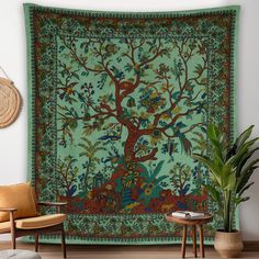 a tapestry hanging on the wall in a living room