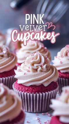 pink velvet cupcakes with white frosting and sprinkles