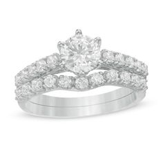 An effortless classic, this diamond bridal set is a beautiful symbol of your love. Crafted in cool 10K white gold, the quintessential engagement ring showcases a 3/4 ct. diamond sparkling atop a diamond-lined shank. Additional diamonds adorn the gallery. Complete her look with contoured diamond-lined wedding band. Captivating with 1-1/2 cts. t.w. of diamonds and a bright polished shine, this bridal set complements her unique style - today and always. Beautiful Symbols, Peoples Jewellers, Diamond Bridal Sets, Bridal Set, Bridal Sets, The Gallery, Wedding Band, Unique Style, Wedding Bands