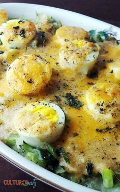 an egg and spinach casserole in a white dish