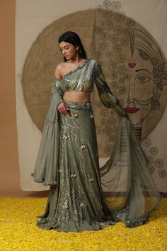 featuring pista green skirt set.comes with one shoulder blouse and ruffled net dupatta. Fabric : GEORGETTE GREEN Color FIT FITTED Lining Material crepe 3-4 weeks delivery 3 Components Cape Lehenga, Lehenga And Blouse, Kurta Lehenga, Lehenga Pattern, Pista Green, Green Lehenga, Lehenga Skirt, Lehenga Blouse, Embellished Blouse