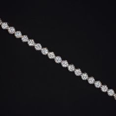 This brilliantly sparkling tennis bracelet has a classic design that will never go out of style! Featuring 5.00 carats of vibrant lab grown diamonds, this beauty offers brilliant, eye catching sparkle. This bracelet is sure to delight and would make an excellent gift for a special someone or for yourself. The diamonds are bright white and exceptionally clean, graded D-E VVS-VS. They are all excellent cut for fantastic sparkle! The diamonds are all lab grown, offering all the beauty and durabilit Sparkling Lights, Diamond Tennis Bracelet, Tennis Bracelet Diamond, Lab Created Diamonds, Tennis Bracelet, Out Of Style, Bright White, Lab Grown, Colored Diamonds