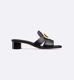 The 30 Montaigne heeled slide is an essential Dior wardrobe piece. The gold-finish metal CD signature highlights the silhouette and contrasts with the black calfskin. Featuring an elegant square toe and 3.5 cm (1.5) cylindrical heel, the slide's timeless lines will complete any attire with ease.. Color Oro, Lady Dior, Mule, Gold Finish, Women's Shoes Sandals, Calf Skin, Metallica, Shoes Sandals, Cd