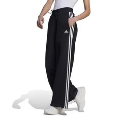 When these pants go on, it's a sign you're staying in. Made with fleece for a cozy feel, these adidas wide-leg pants are super comfortable so they're great for unwinding after a busy day.Click on this WOMEN'S GUIDE to find the perfect fit and more! When these pants go on, it's a sign you're staying in. Made with fleece for a cozy feel, these adidas wide-leg pants are super comfortable so they're great for unwinding after a busy day.Click on this WOMEN'S GUIDE to find the perfect fit and more! TE Sports Pants Women, Busy Day, Wide Pants, Bottom Clothes, Staying In, Maternity Tops, A Sign, Sport Pants, Stripes Design