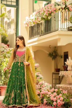 Green Pishwas Frock and Lehenga Pakistani Bridal Dress is a traditional masterpiece that gives you a head-turning appearance at the Mehndi event. This stunning Pishwas Dress is hand-embellished with shimmering golden details and embellishments, making it an epitome of beauty and elegance. Pishwas: Pishwas Frock in an alluring green shade is emblazoned with classic gota and zardosi details. Threads, tilla, and Sequin embellishments enhance the glamour of this beautiful Pakistani Bridal Pishwas. Y Bridal Pishwas, Mehndi Event, Lehenga Pakistani, Pakistani Bridal Dress, Mehndi Dress, Raw Silk Lehenga, Green Lehenga, Pakistani Wedding Outfits, Lehenga Style