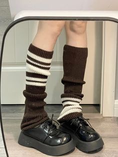 Add a touch of cozy charm to your outfit with these knitted leg warmers, adorned with a stylish striped pattern. Perfect for achieving a layered and textured look, these leg warmers are a versatile accessory that can be paired with skirts, shorts, or dresses for a chic and comfortable ensemble. The soft, stretchy fabric ensures a snug fit while keeping you warm.Elevate your fashion game with this must-have accessory!   Please note that the price is for one pair of leg warmers. Skirts With Leg Warmers, Casual Striped Leg Warmers For Winter, Casual Striped Leg Warmers For Fall, Brown Leg Warmers For Fall, Brown Casual Winter Leg Warmers, Casual Brown Warm Leg Warmers, Casual Brown Leg Warmers For Winter, Casual Brown Leg Warmers, Casual Brown Winter Leg Warmers