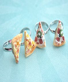 This friendship ring set features a pair of handmade pizza slices sculpted from polymer clay. Each pizza slice measures about 0.8" and is securely attached to an adjustable silver tone ring that fits most ring sizes. SKU 1440 Polymer Charms, Pizza Ring, Bff Rings, Handmade Pizza, Art Rings, Food Rings, Friend Rings, I Love Pizza, Miniature Food Jewelry